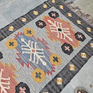 Handwoven Wool Kilim Rug: Bohemian Southwestern Dhurrie