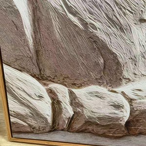 May include: Close-up of a textured abstract painting in a wooden frame. The artwork features a palette of neutral tones, including shades of brown, beige, and white, creating a sense of depth and dimension. The brushstrokes are visible, adding to the tactile quality.