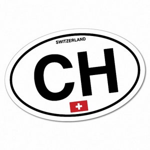 May include: White oval sticker with the letters "CH" in black, the word "SWITZERLAND" in smaller black letters above the letters, and a red Swiss cross below the letters.