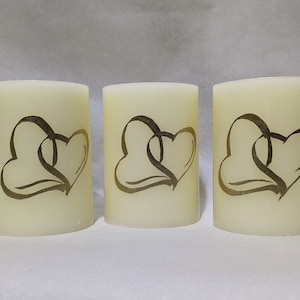 Gold Heart Candle - Our beautiful Entwined Golden Hearts Candle is an Elegant add-on for all Special Occasions, Weddings, and Anniversaries.