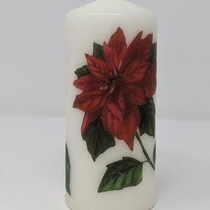 Elegant Poinsettia 5 1/2 inch Unscented Pillar Candle adds a special touch to your Seasonal Centerpiece.