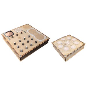 May include: Two wooden boxes with different designs. The larger box has a copper-colored plate and a grid of 16 knobs. The smaller box has a circular design with eight knobs.