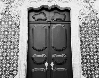 This black and white photograph features an old architectural door, surrounded by intricate Portuguese mosaic tiles. Home office decor