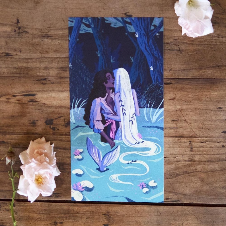 May include: A painting of two figures embracing in a blue pond. The figure on the left has dark hair and is wearing a blue and pink dress. The figure on the right has long white hair and is wearing a white dress. The pond is surrounded by green reeds and lily pads.