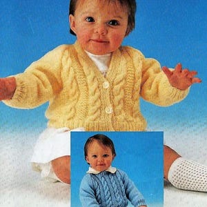 May include: A baby in a yellow cable-knit cardigan with three white buttons. The cardigan has a V-neck and long sleeves. The baby is also wearing a white outfit. A smaller image shows a baby in a blue cable-knit sweater.