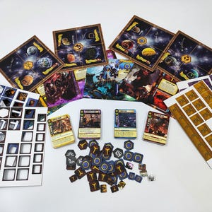May include: A board game set with various components, including game boards depicting planets, cards with illustrations, and numerous tokens. The color palette includes blues, browns, and yellows, suggesting a space or fantasy theme.