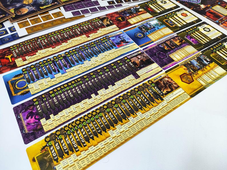 May include: An assortment of colorful board game components, including cards and player boards, are arranged on a white surface. The cards feature various illustrations and text, with a mix of colors like blue, purple, and yellow. The game pieces are ready for play.