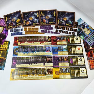 May include: A collection of board game components, including cards, tiles, and tokens. The cards feature colorful illustrations of planets and characters. The color palette includes shades of purple, gold, and blue.