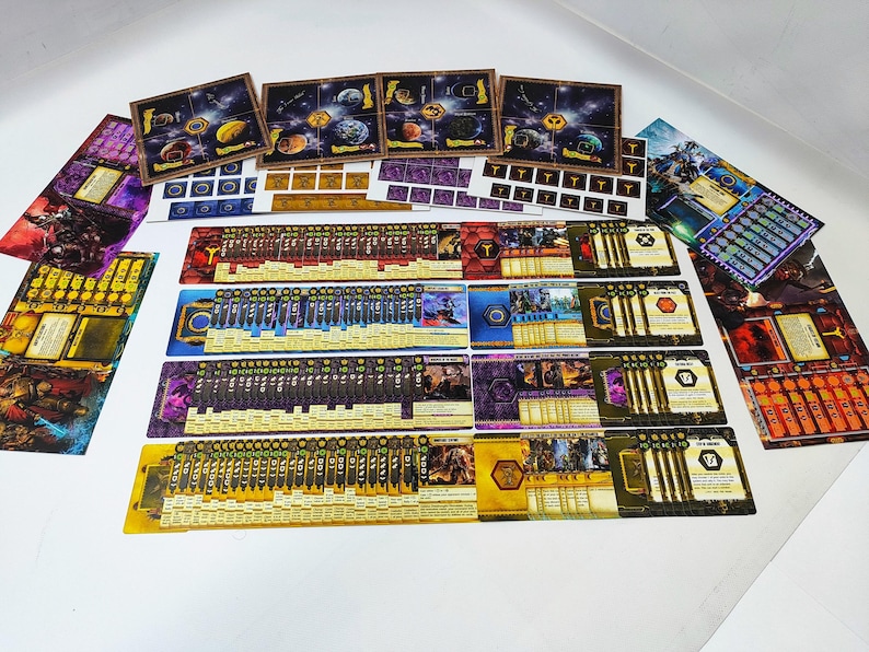 May include: A collection of board game components, including cards, game boards, and tokens. The cards feature various illustrations and text, with a color palette of gold, purple, and blue. The game boards depict celestial scenes.