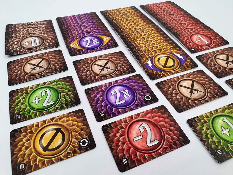 May include: A set of game cards with various symbols and numbers. The cards have a brown, purple, green, or red background with a floral pattern. The symbols include swords, a circle with a slash through it, and a circle with a 2x inside. The numbers include +0, +2, -1, -2, and 2x.