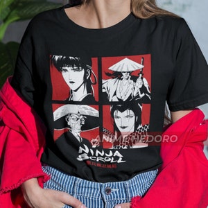 May include: Black t-shirt with a graphic print of four characters from the anime Ninja Scroll. The characters are in red and white squares with a black background. The text "Ninja Scroll" is in white with Japanese characters below it.
