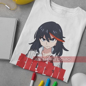 May include: White t-shirt with a red and black anime character graphic. The character has black hair and red eyes. The text "Anime Hedoro" is printed below the character. The t-shirt is lying on a gray surface with a yellow pair of headphones, a notebook, and four white markers.