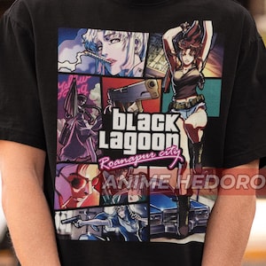 May include: Black t-shirt with a graphic print of characters from the anime Black Lagoon. The graphic includes the text "Black Lagoon Roanapur city" and "Anime Hedoro".