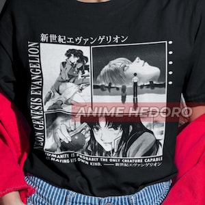 May include: Black t-shirt with a white graphic print of characters from the anime Neon Genesis Evangelion. The graphic includes the Japanese text "新世紀エヴァンゲリオン" (Shin Seiki Evangelion) and the text "HUMANITY IS PROBABLY THE ONLY CREATURE CAPABLE OF HATING ITS OWN KIND."