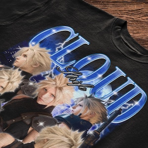 May include: A black t-shirt featuring a graphic print of the character Cloud Strife from Final Fantasy. The design includes multiple images of the character with spiky blonde hair, blue lightning effects, and the text CLOUD Strife in blue.