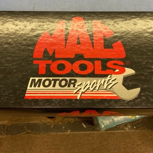 May include: A black box with a red and white "MAC TOOLS MOTORSPORTS" logo. The box is labeled "1/4544 Limited Edition 1995" and "1/3 SCALE TOP FUEL DRAGSTER".