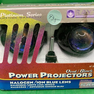 May include: A pair of black oval power projector headlights with blue ion lenses. The packaging features the brand name "Rayzor" and the text "Platinum Series Lifetime Warranty".