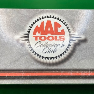 May include: A white box with a red and black logo for MAC TOOLS Collector's Club. The box is for a 1:24 scale Crystal Funny Car, a limited edition auto collectible. The box has a red number 795 on it and the text "John Force Castrol GTX 1959 Funny Car Crystal 1 of 5,004 P249928254-3".