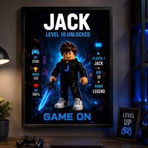 May include: A framed poster featuring a block-style character in a black hoodie with a blue J, holding a glowing blue sword. Text includes JACK, LEVEL 10 UNLOCKED, XP 2500, WINS 120, HP 100%, PLAYER 1 JACK, AGE 10, RANK LEGEND, and GAME ON in blue.
