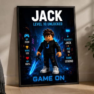 May include: A framed poster featuring a cartoon character in a black hoodie with a blue J, holding a glowing blue sword. Text includes JACK, LEVEL 10 UNLOCKED, XP 2500, WINS 120, HP 100%, PLAYER 1 JACK, AGE 10, RANK LEGEND, and GAME ON in blue and white.