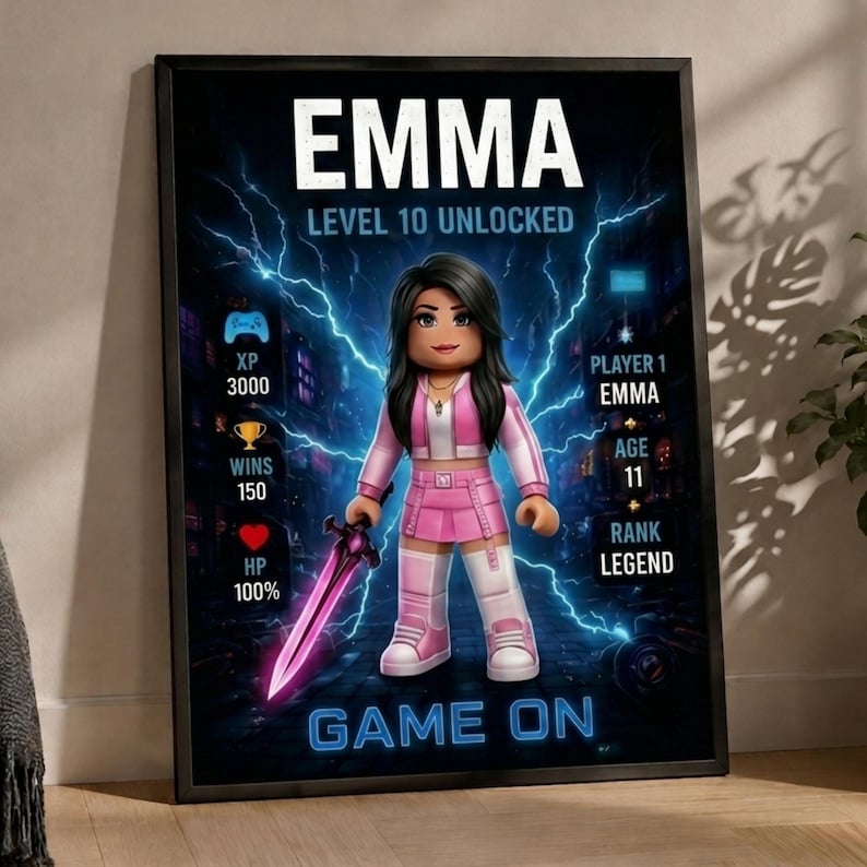 May include: A framed poster featuring a digital avatar character with long dark hair, wearing a pink and white outfit, holding a glowing purple sword. The background shows blue lightning effects, game statistics, and the text EMMA, LEVEL 10 UNLOCKED, GAME ON.