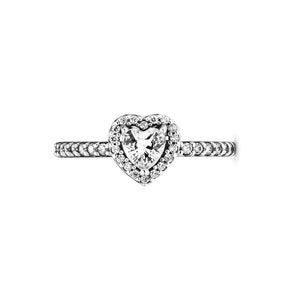 May include: A silver ring featuring a heart-shaped centre stone surrounded by smaller stones. The band is also set with smaller stones.