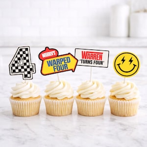 May include: Four cupcakes with white frosting and decorative toppers. The toppers include a checkered number 4, a yellow arrow with "WARPED FOUR", a sign that says "WARREN TURNS FOUR", and a yellow smiley face with lightning bolts.