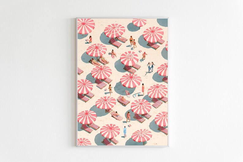 May include: A framed art print depicting a beach scene with numerous pink and white striped umbrellas, beach chairs, and small figures of people. The artwork has a vintage, retro aesthetic, with a light beige background and blue shadows.