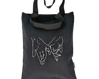 Black Linen Tote Bag: Couple Holding Hands Embroidery