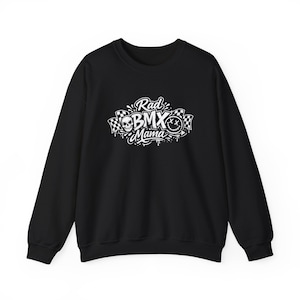 May include: Black sweatshirt with a white graphic that reads "Rad BMX Mama." The design includes a skull, a smiley face, and checkered flags. The sweatshirt has a crew neck and long sleeves.