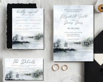 May include: Wedding invitation suite featuring a watercolour design of a misty lake and trees. The invitation card displays the couple's names, wedding date, and venue. The RSVP card includes a response deadline and meal options. The details card provides information about the reception.