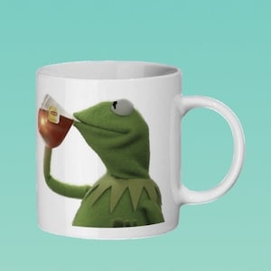Kermit the frog sipping tea, that’s none of my business meme Mug (Link to matching coaster in description)