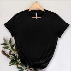 May include: A black short-sleeved t-shirt with a crew neck. The shirt is made of a soft, comfortable fabric and has a relaxed fit.