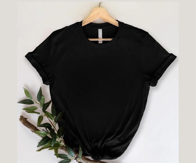 May include: A black short-sleeved t-shirt with a crew neck. The shirt is made of a soft, comfortable fabric and has a relaxed fit.