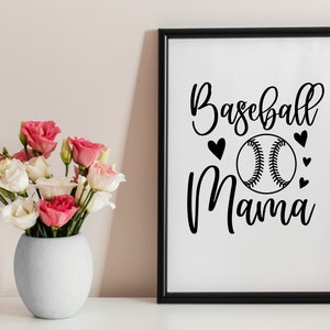 May include: A black and white framed print with the text "Baseball Mama" and a baseball graphic. The print is on a white background and has small hearts around the baseball.