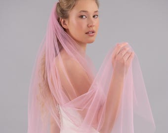 May include: A pink tulle bridal veil with a soft, flowing design. The veil is sheer and delicate, with a subtle shimmer.