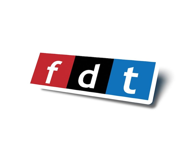 May include: A sticker with the letters "fdt" in white, each letter on a different colored background: red, black, and blue.