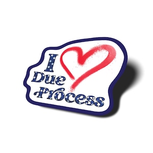 May include: A white sticker with a blue border and the words "I Due Process" in blue with white stars. A red heart is spray-painted over the words. The sticker has a shadow.