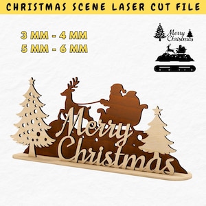 May include: A laser-cut wooden Christmas scene featuring Santa Claus in a sleigh pulled by a reindeer, with the words "Merry Christmas." Two Christmas trees flank the scene. The text "CHRISTMAS SCENE LASER CUT FILE" is at the top.