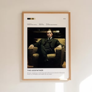May include: Framed movie poster for "The Godfather" featuring a seated man in a suit. The poster includes the film's title, director, writer, and actors. The year 1972 is displayed. A quote from the film is at the bottom.