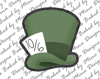 May include: A green top hat cookie cutter with a black outline and a white tag that reads "10/6". The hat is a classic design, perfect for themed baking projects. The design is from "Mina Designs Baked by Mina Designs".