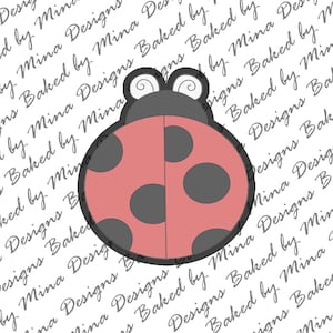 May include: A pink ladybug cookie cutter with black spots and antennae. The cookie cutter is on a white background with the text "Designs Baked by Mina" repeated.
