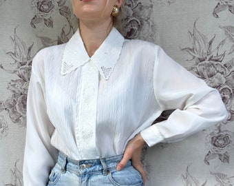 Vintage white pleated blouse with embroidery, elegant women’s long sleeve shirt