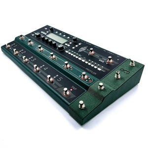 May include: A green guitar effects pedal with multiple footswitches and a digital display. The pedal has a black faceplate with the text "PROFILER" and "OC5".