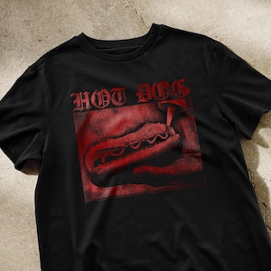 May include: Black t-shirt with a red graphic of a hot dog with the text "HOT DOG" above it.