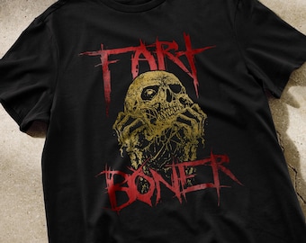 May include: Black t-shirt with a red and gold graphic of a skull with the text "Fart Boner" printed on it.