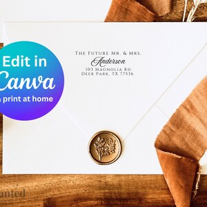 May include: A white envelope with a wax seal and the text "THE FUTURE MR. & MRS. Anderson 103 MAGNOLIA RD DEER PARK. TX 77536" printed on it. The envelope is on a wooden surface with a brown ribbon.