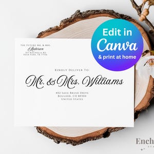 May include: A white card with a wedding address label. The label says "The Future Mr. & Mrs. Anderson 10T Magnolia Rd Deer Park, TX 77536" and "Kindly Deliver To: Mr. & Mrs. Williams 402 Sage Brush Drive Boulder, CO 80304 United States". The card is on a wooden slice with a white flower behind it. A circle with the text "Edit in Canva & print at home" is in the upper right corner of the image. The text "Enchanted Stamps" is at the bottom of the image.