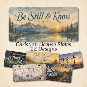 May include: A collection of rectangular license plates featuring landscape illustrations and religious text. The top plate displays mountains, a lake, and the text Be Still & Know. Other plates show text including The Lord Is My Shepherd, Glory of, Jesus is Lord, Fearfully & Wonderfully Made, and Walk by Faith.