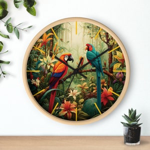 May include: A round wooden clock with a colorful jungle scene featuring two parrots, one red and one blue, perched on branches with green leaves and flowers. The clock face is visible with black hands.